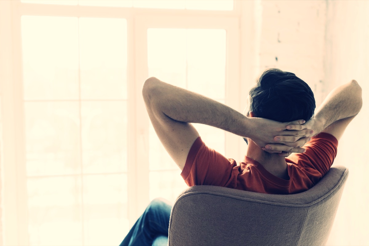 freepik-faceless-man-relaxing-in-armchair