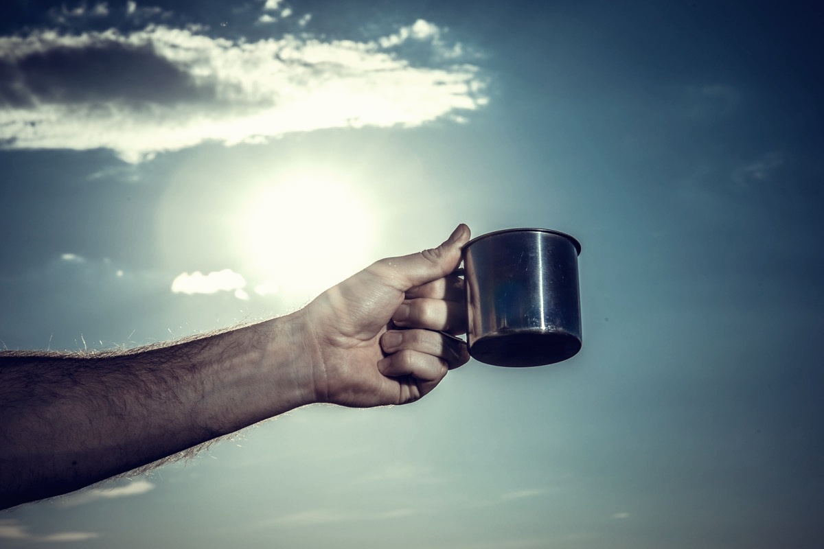 freepik-a-metal-mug-in-a-man